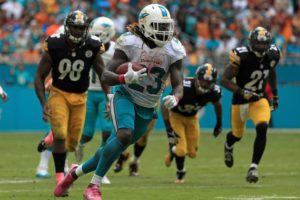 The long expected run game finally arrived and brought toughness to every aspect of the Dolphins.